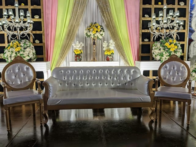 Elegant seating area with tufted sofa, ideal for luxurious event in Bukhara Royale.