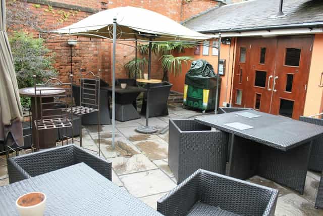 Outdoor event space at The Orange Tree with versatile seating for networking gatherings.