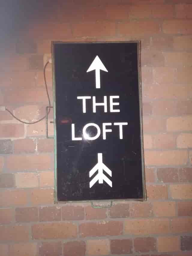 Directional sign for The Loft at The Orange Tree, enhancing event navigation and guest experience.