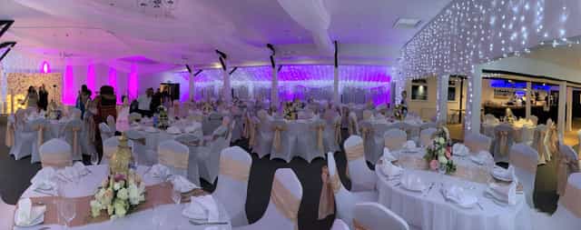 Elegant Charis Lounge with soft purple lighting, perfect for weddings or formal events.