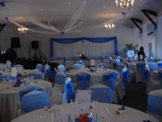 Elegant conference room with round tables, perfect for corporate events or gatherings.