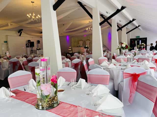 Elegant Sapphire Ballroom setup with pink accents for romantic weddings and gatherings.
