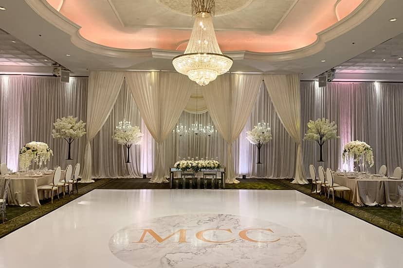 Elegant Oasis Ballroom with floral decor, perfect for weddings and upscale events.