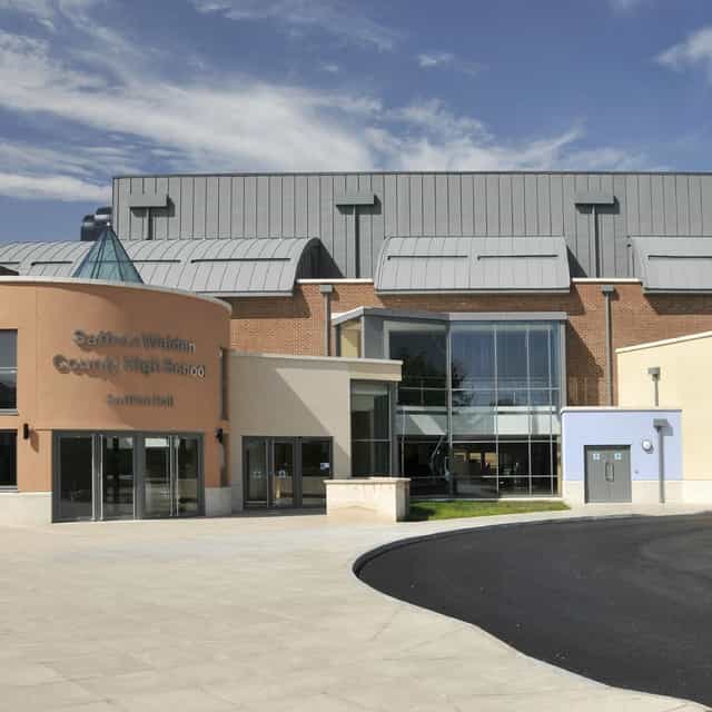 Modern Saffron Hall concert venue with glass windows, ideal for meetings and conferences