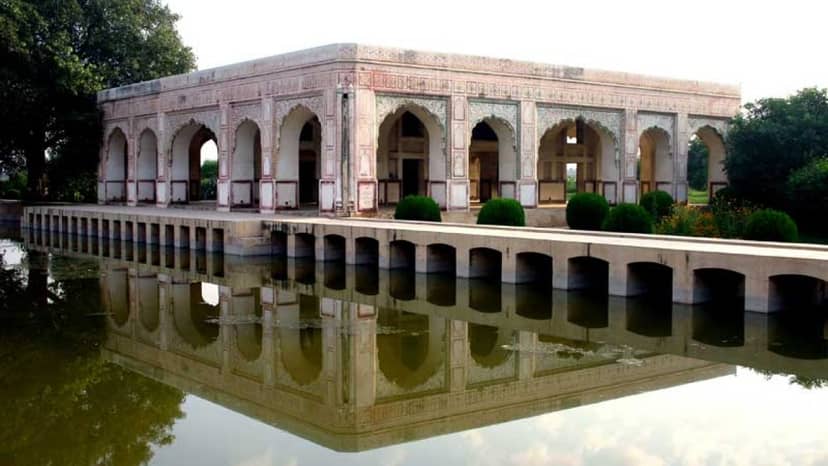 Neo-Mughal Pavilion reflection in water, perfect for weddings and outdoor events.