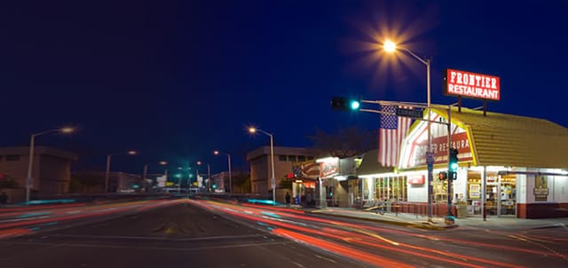 Illuminated restaurant exterior, perfect for casual dinners and networking events at dusk.