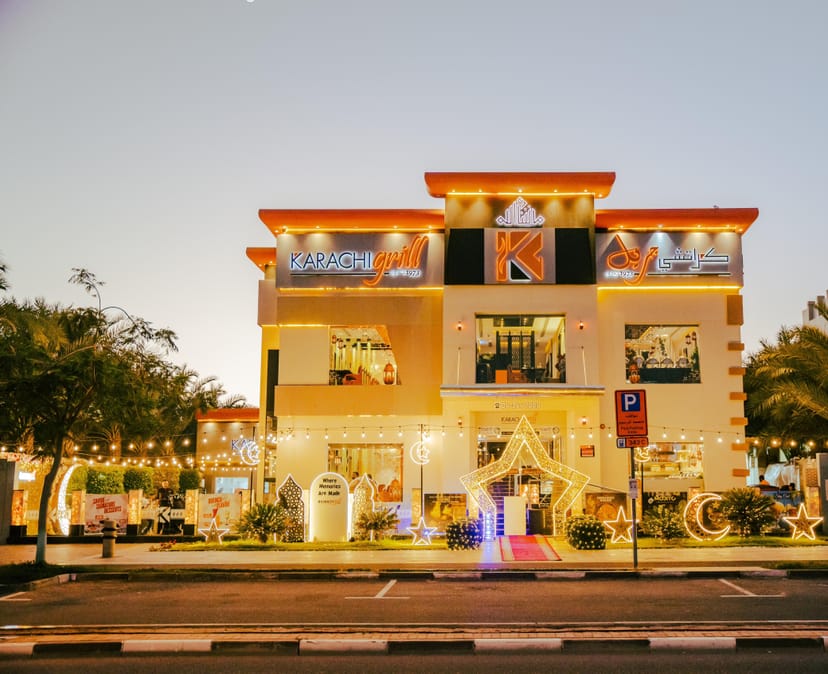 Lawn area at Karachi Grill Restaurant with vibrant lighting for corporate events and celebrations.