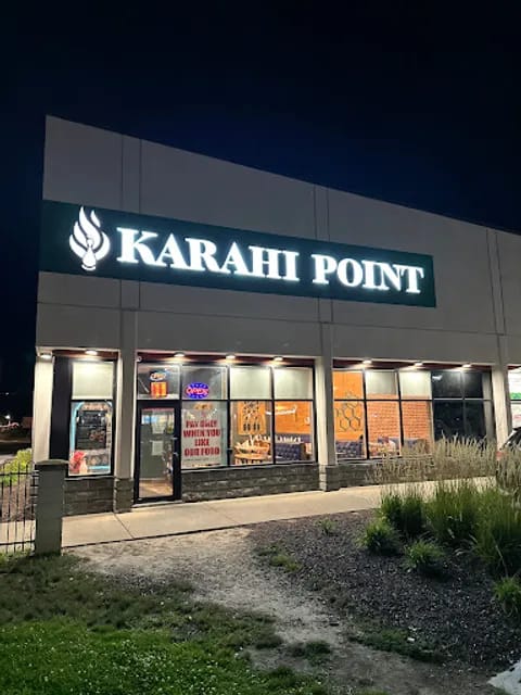 Illuminated exterior of Karahi Point restaurant, ideal for casual meetings and events.