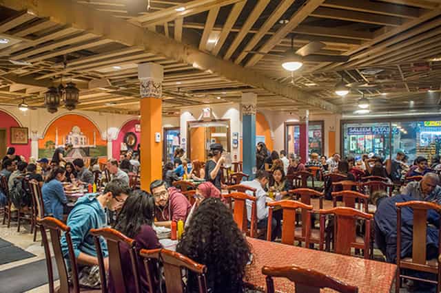 Lahore Tikka House bustling restaurant with vibrant decor, ideal for social events.