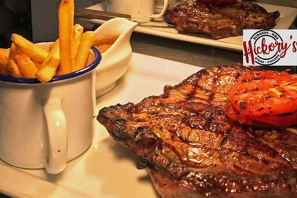 Plated steak with fries at Lahore Kebab House, ideal for corporate events and networking.
