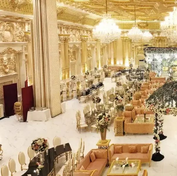 Opulent banquet hall with floral centerpieces, ideal for weddings and events.