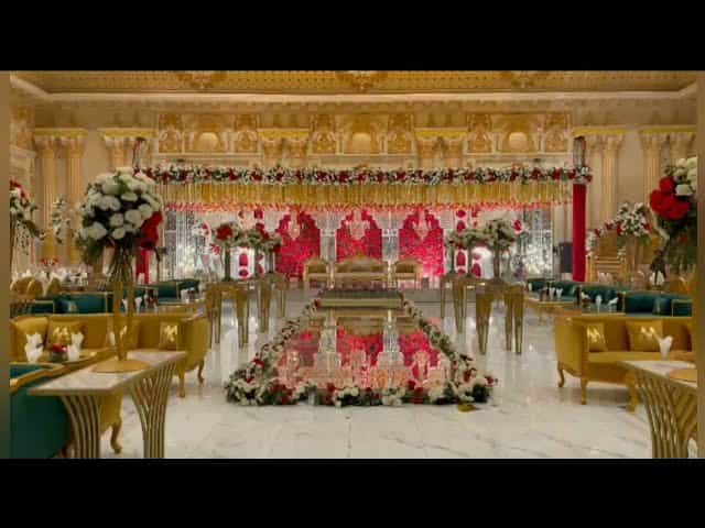 Lavish wedding venue with gold accents and floral arrangements in Majesty Event Complex.