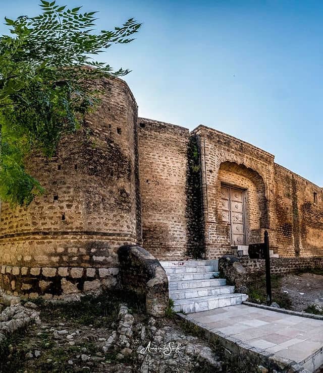 Gurdwara Dera Sahib venue with rustic stone architecture for unique outdoor events.