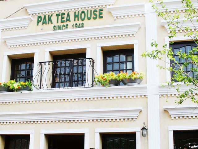 Historic Pak Tea House exterior with decorative window boxes for cultural events.