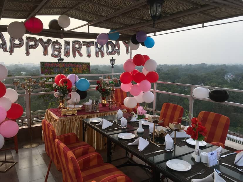 Elegant rooftop event space with vibrant decor, perfect for birthday celebrations at Bistro 201.