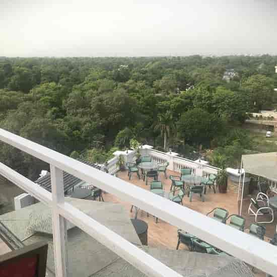 "Outdoor terrace at Bistro 201, ideal for intimate gatherings and networking events."