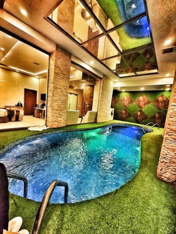 Luxurious indoor pool at Hilton Suites Lahore, ideal for upscale events and retreats.