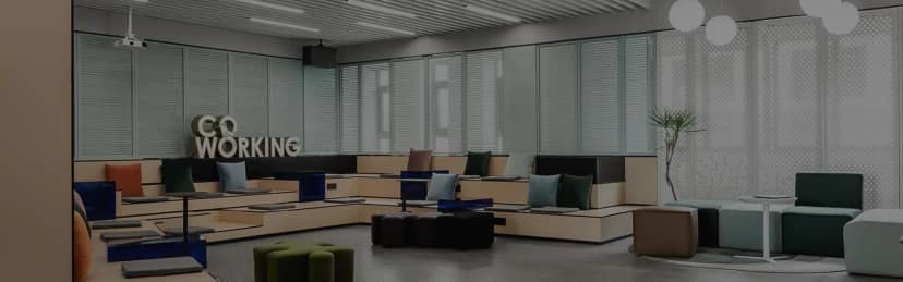 Modern meeting room with tiered seating, perfect for workshops and gatherings.