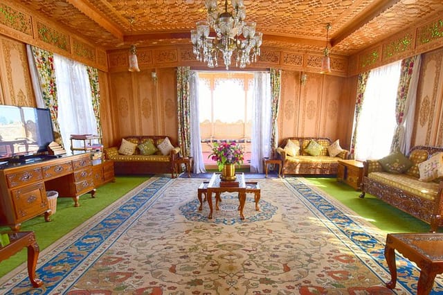 Cozy houseboat meeting space with wooden paneling for executive retreats and brainstorming.