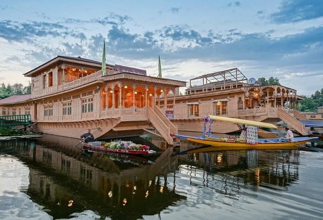 Traditional houseboat on tranquil waters, perfect for luxury events and retreats.