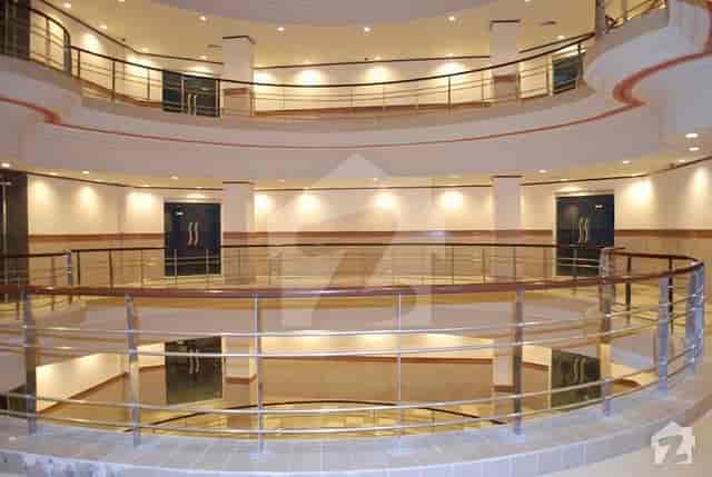 Modern offices in Shaheen Complex Lahore with spacious atrium for conferences and receptions.