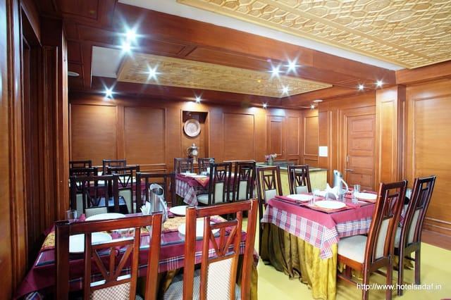 Elegant vegetarian restaurant dining space at Hotel SADAF for exclusive events and meetings.