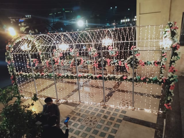 Mannsiraj Hall archway with lights, perfect for weddings and gala events.