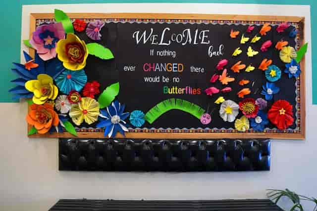 Vibrant paper flowers in Iqbal Town Campus studio for inspiring events and workshops.