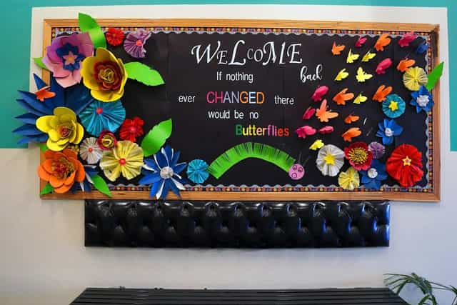Vibrant paper flowers in Iqbal Town Campus studio for inspiring events and workshops.