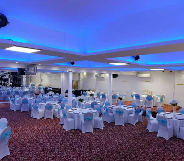 Elegant banquet hall in Royal Mahal, set for weddings and corporate events.