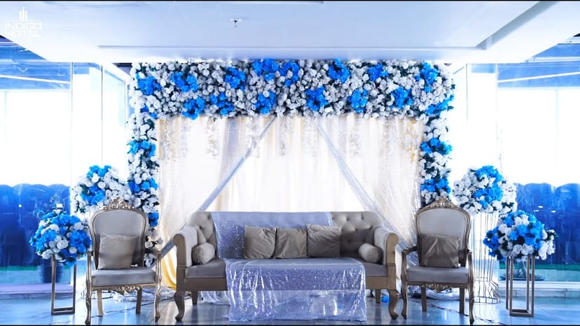 Elegant wedding hall at Indigo Hotel with blue and white floral decor. Perfect for ceremonies.