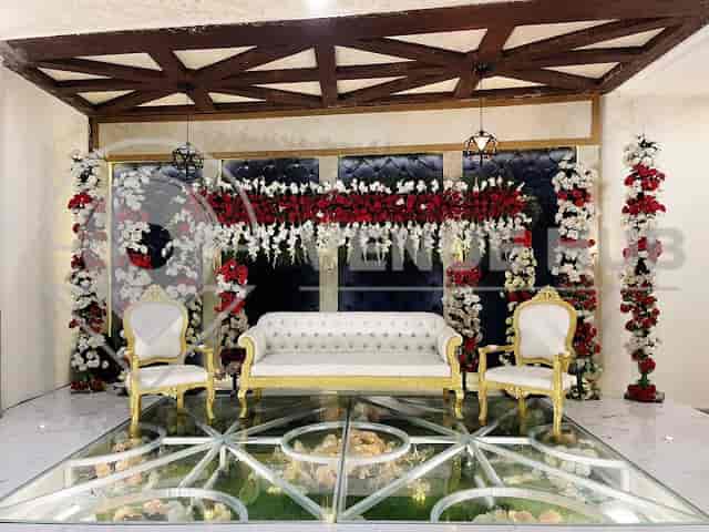 Elegant wedding hall at Indigo Hotel with gold accents and floral decor. Perfect for upscale events.
