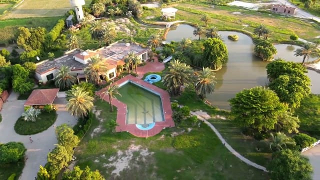 Outdoor venue with pool and greenery for weddings and retreats at VenueHub.