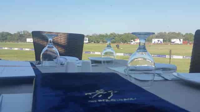 Elegant outdoor dining setup in Green Lounge for corporate events and gatherings.