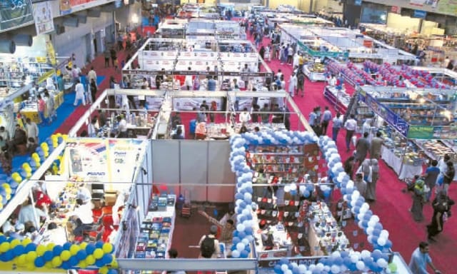 Lahore International Book Fair Hall No.1, bustling trade show with vibrant booths.
