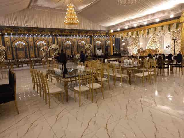 Elegant event suites with gold decor and chandelier at Grand Sapphire Marquee.