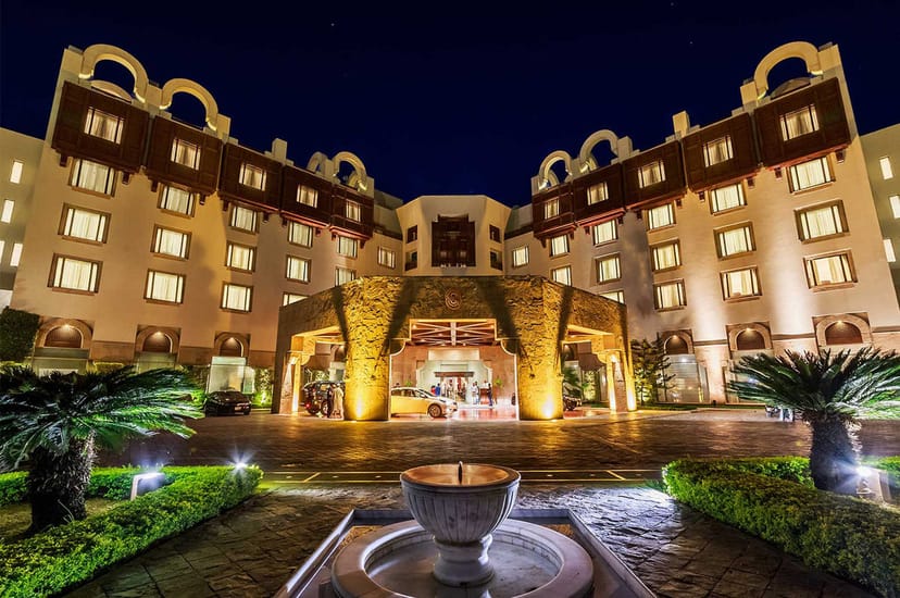 Kehkashan Hall at Ramada Islamabad: elegant night facade, perfect for events and meetings.