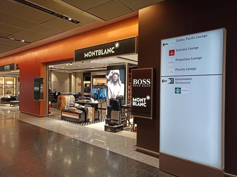 Sleek lounge in MLKH Studentenwohnheim with Montblanc and BOSS branding for premium events.