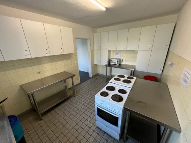Functional kitchen in MLKH Studentenwohnheim, ideal for catering events and large groups.