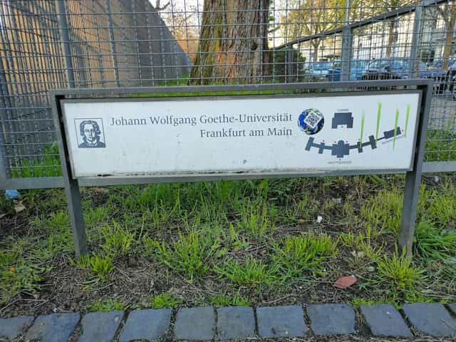Goethe University Frankfurt lecture hall sign for academic conferences and seminars.