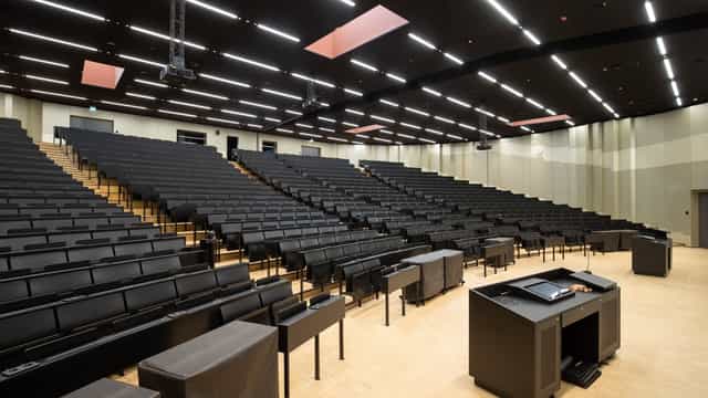 Modern lecture hall with tiered seating at Goethe University for conferences and seminars.