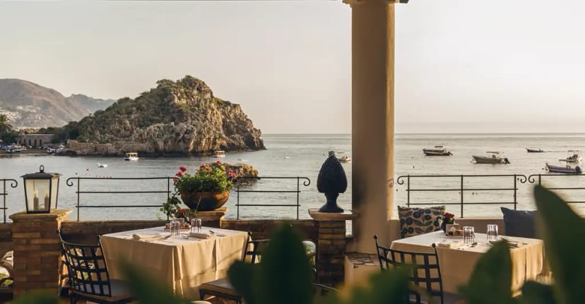 "Elegant outdoor dining terrace at Villa Sant'Andrea, perfect for events in Taormina."