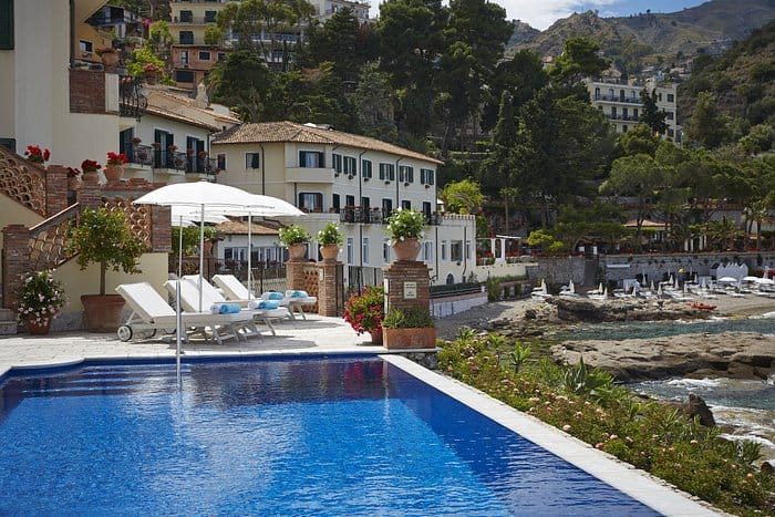 Beachfront venue with pool at Villa Sant'Andrea for corporate retreats and leisure events.
