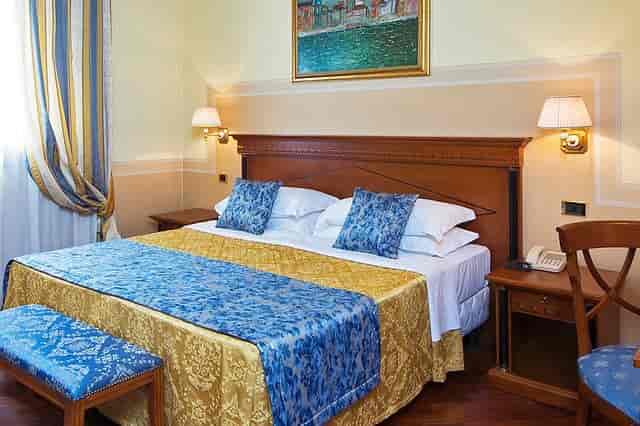 Elegant hotel suite at Villa Pace, ideal for conferences and luxury events.