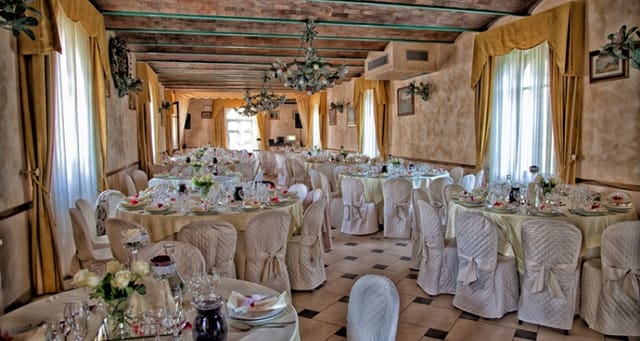 Elegant wedding venue at Villa il Poggione with charming table settings and soft lighting.