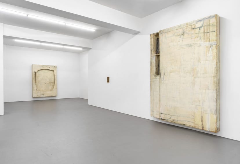 Minimalist art gallery with abstract artworks, perfect for intimate events and exhibitions.