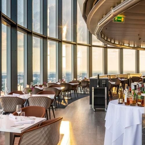 Elegant Medici Restaurant in Frankfurt with floor-to-ceiling windows for corporate events.