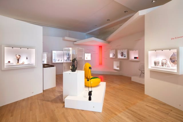 Contemporary exhibition space with display cases, ideal for corporate events and private viewings.