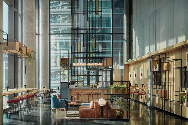 Modern lobby at Le Méridien Frankfurt, ideal for networking events with natural light.