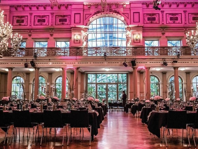 Elegant Emporensaal event space with floral centerpieces for weddings or corporate events.
